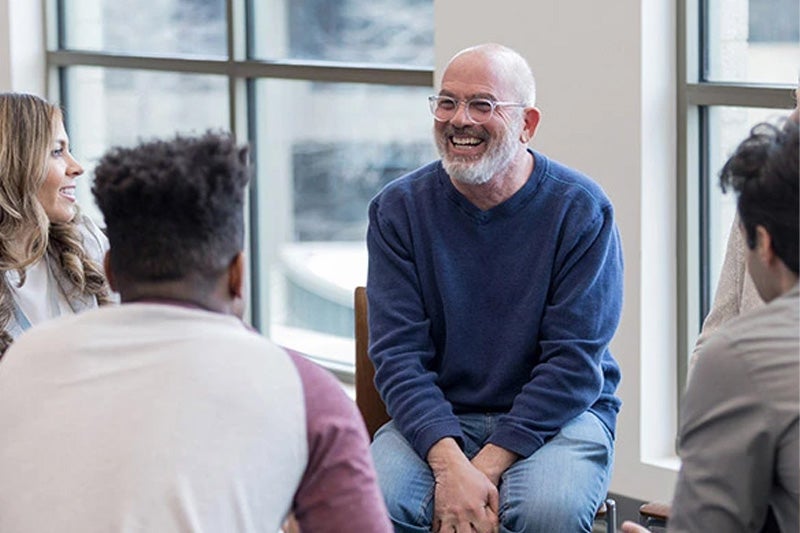 Man sitting at a PTSD support group.
