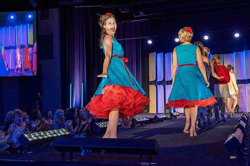 A model gives a final flourish as the Legacy of Style Fashion Show wraps up. (Photo courtesy of Wingate Downs Photography)