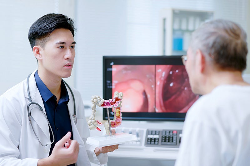 Colorectal surgeon discussing Diverticulitis Surgery with a patient.