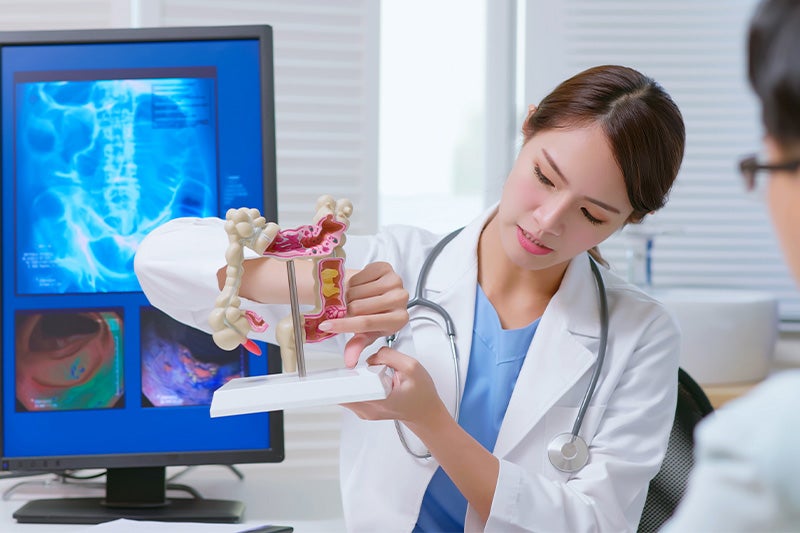 Colorectal surgeon explaining Hemorrhoid Treatment options to a patient.