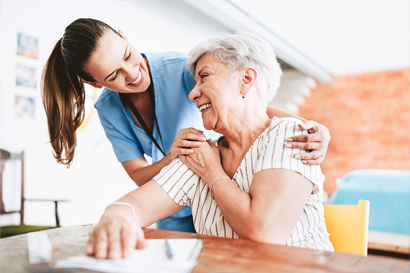 Joint surgery patient speaking to home care nurse.