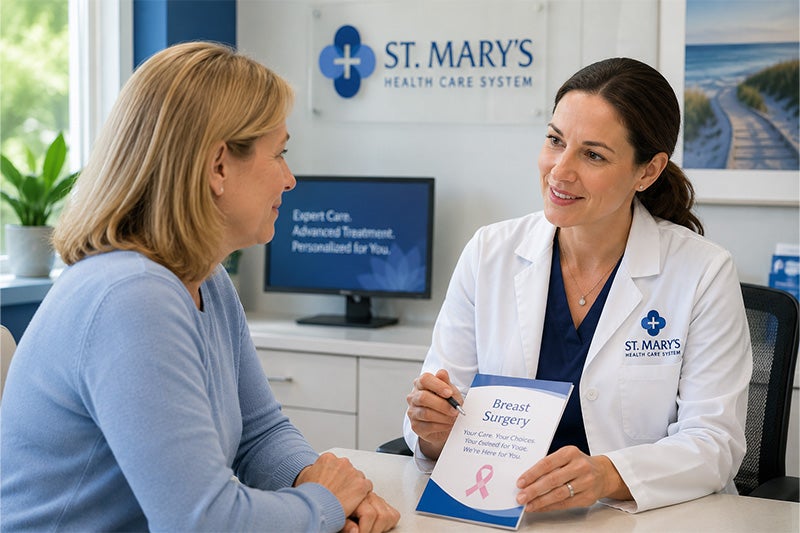 Breast surgeon talking to a patient about Breast Surgery services at St. Mary's Healthcare System.