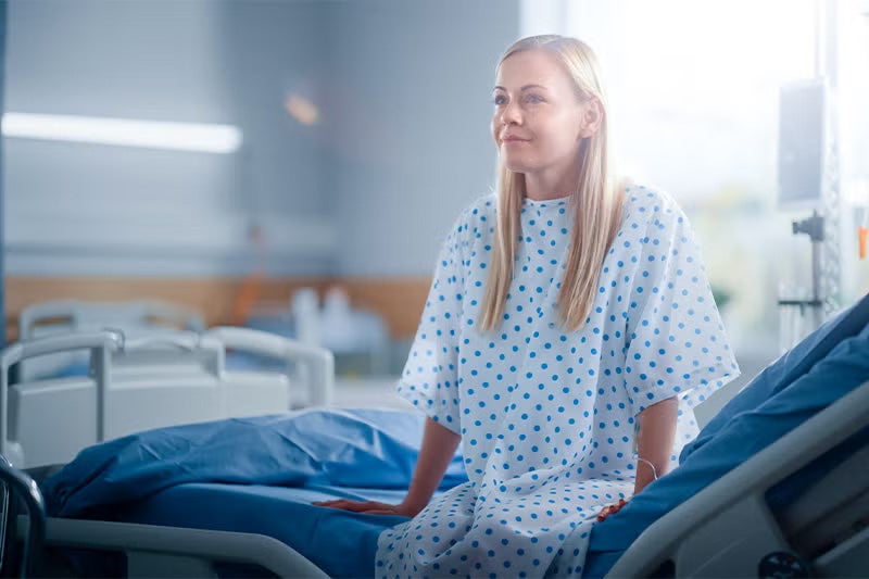 Patient sitting happily after their colorectal surgery procedure.