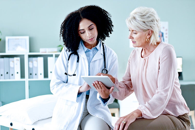 Physician speaking with a patient about Cardiology Services