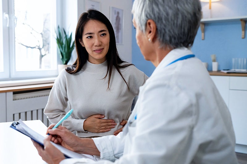 Patient with stomach issues speaking to a gastrointerologist.