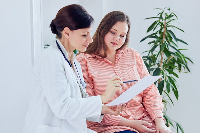 Primary care physician speaking with a patient.
