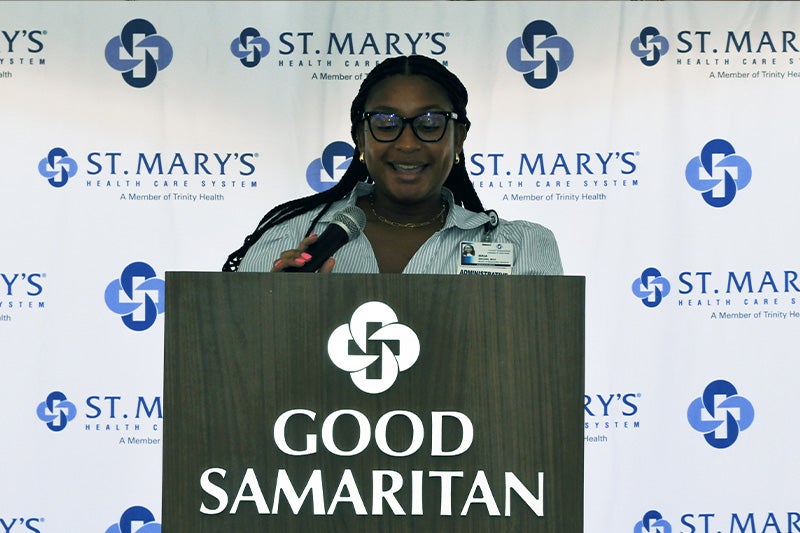 St. Mary's Good Samaritan Hospital Director of Administrative Operations Bria Brown welcomes the overflow audience.