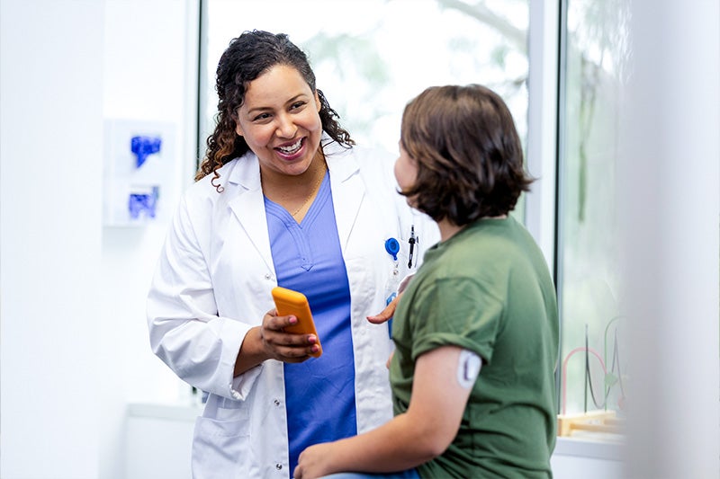Physician speaking to a patient about wound care.