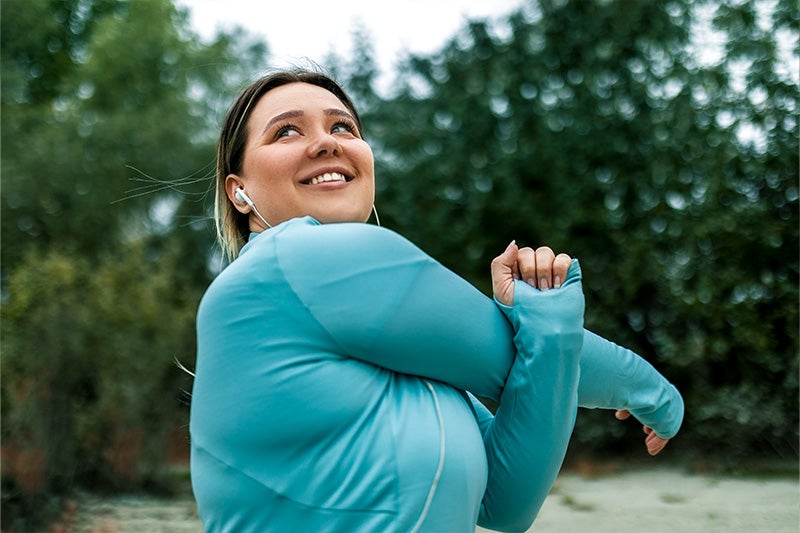 Woman stretching after a run.
