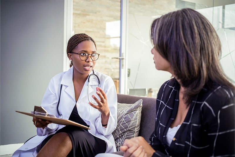 Patient speaking to physician about allergy concerns.