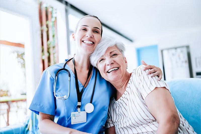 Patient and doctor hugging after a mammogram.